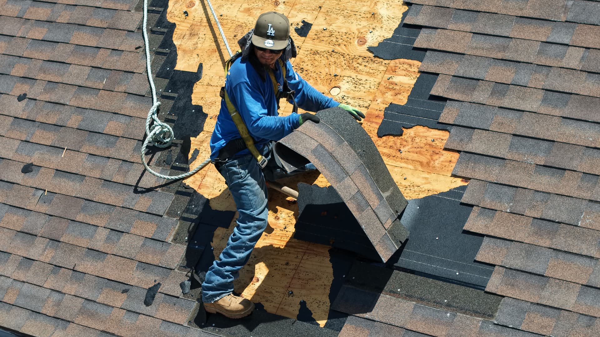 Tear-off in progress, old shingles removed down to clean decking