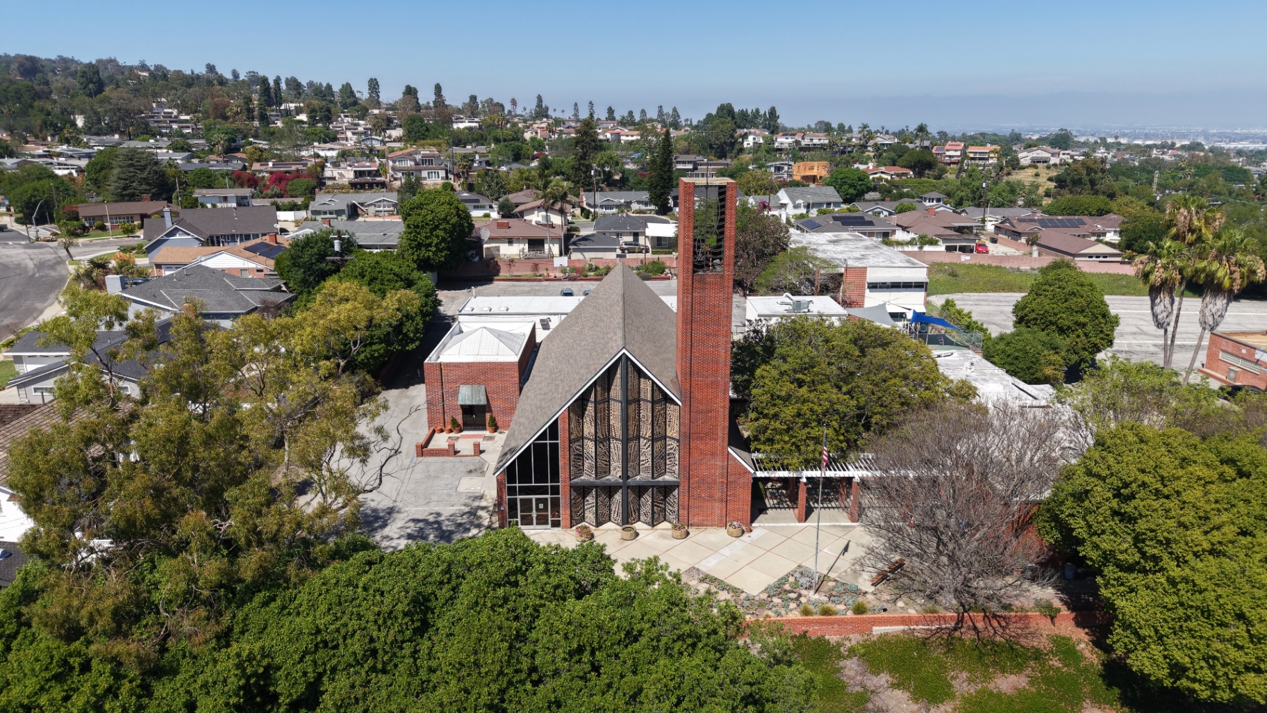 After: completed shingle roof on the church, aerial view