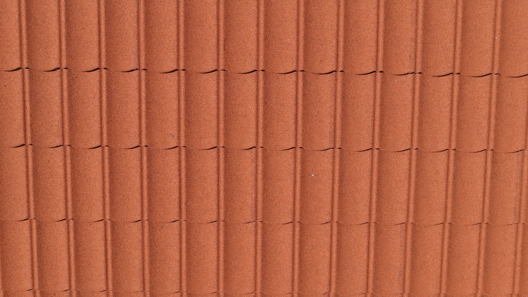 Close-up of new red clay roofing tiles