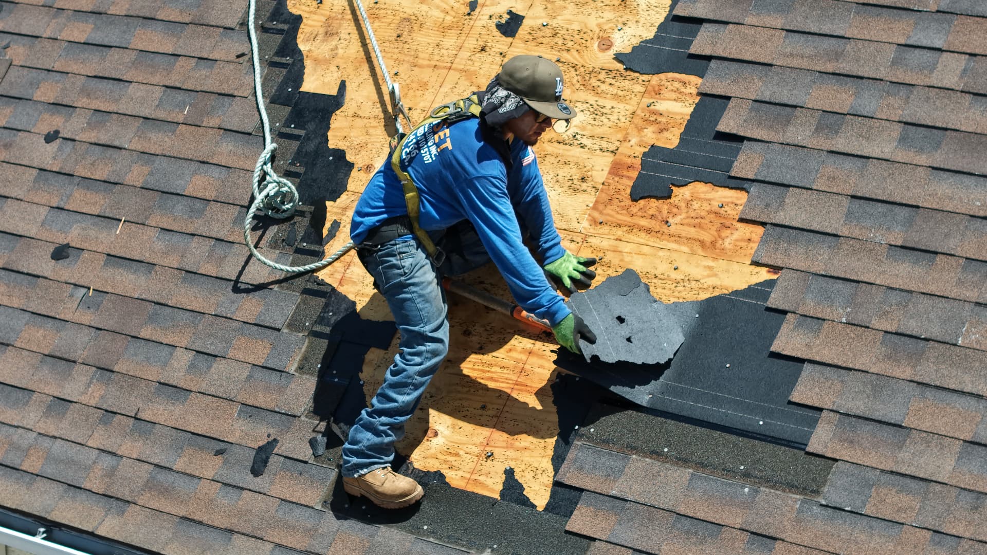 Shingle tear-off and deck prep on a residential re-roof
